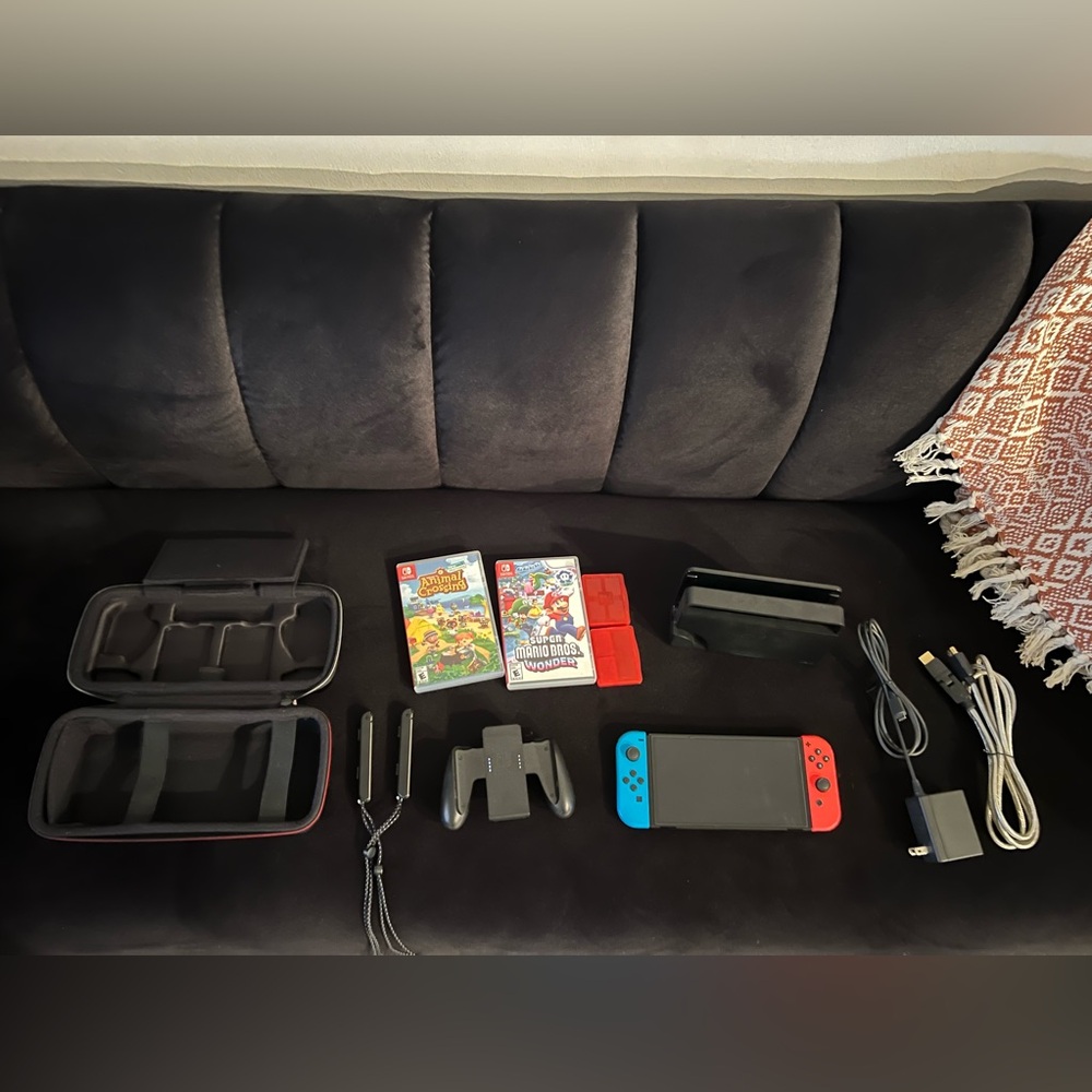 Mint condition Nintendo Oled console with two games additional accessories!